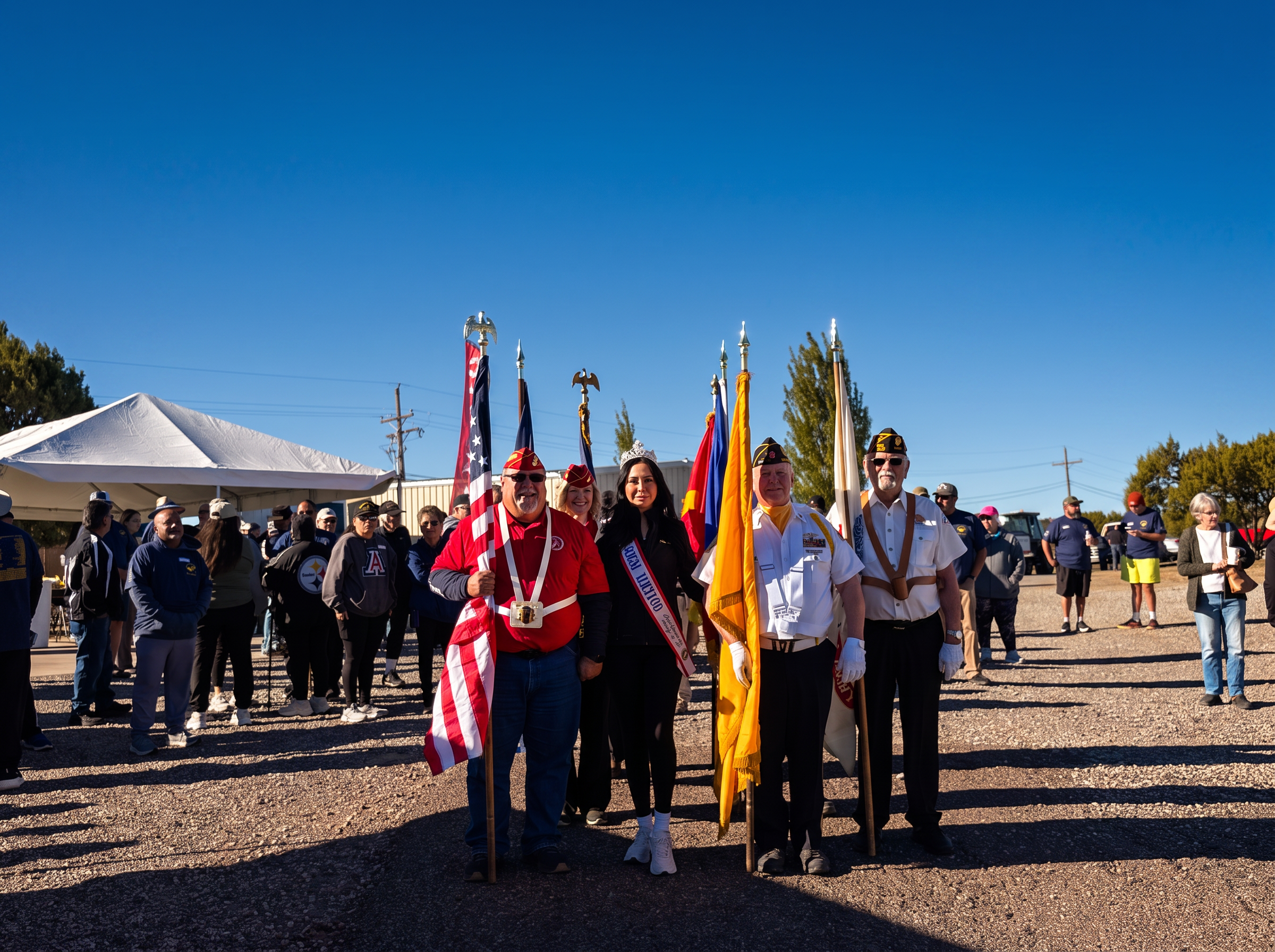 Color guard and attendees gathered before the remembrance march