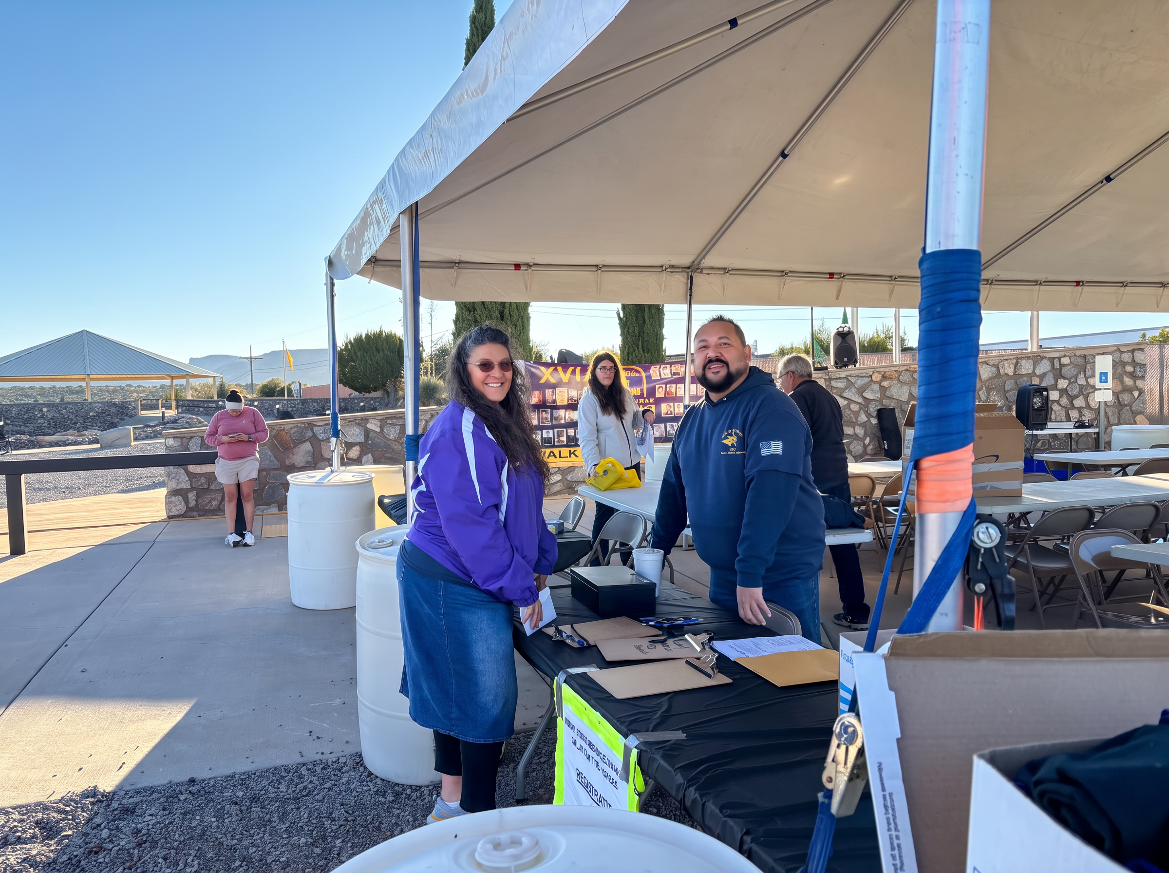 Volunteers welcoming participants at the event registration tent